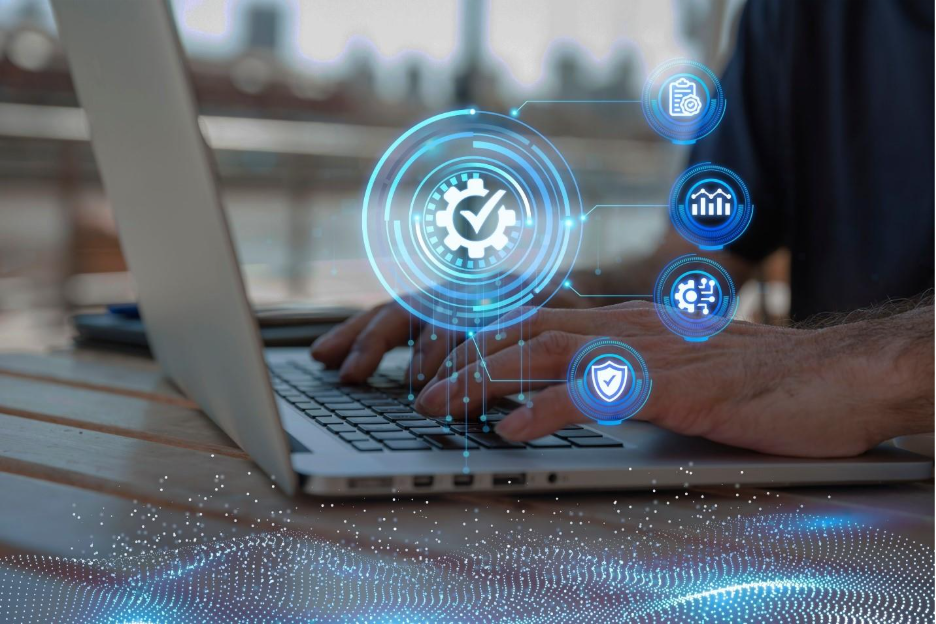 Person typing on a laptop with digital cybersecurity and data management icons overlayed, representing technology, security, and analytics.
