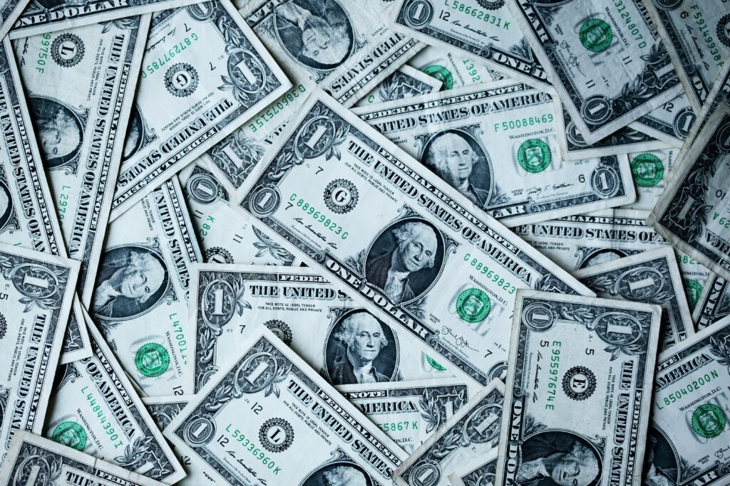 U.S. dollar bills representing next-day funding for high-risk 7-OH merchant processing