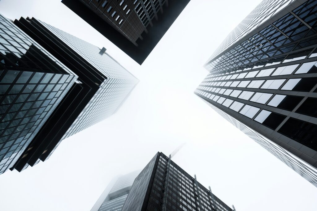 Tall commercial bank buildings symbolizing financial institutions enforcing 7-OH product removal before legal changes