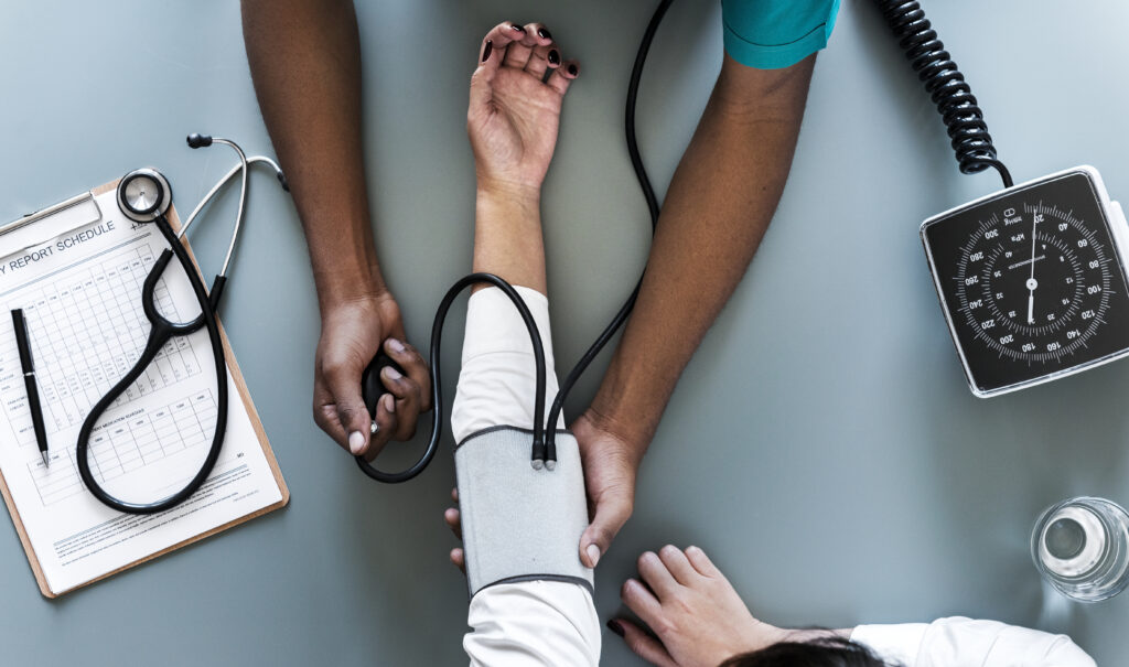nurse-measuring-patient-blood-pressure