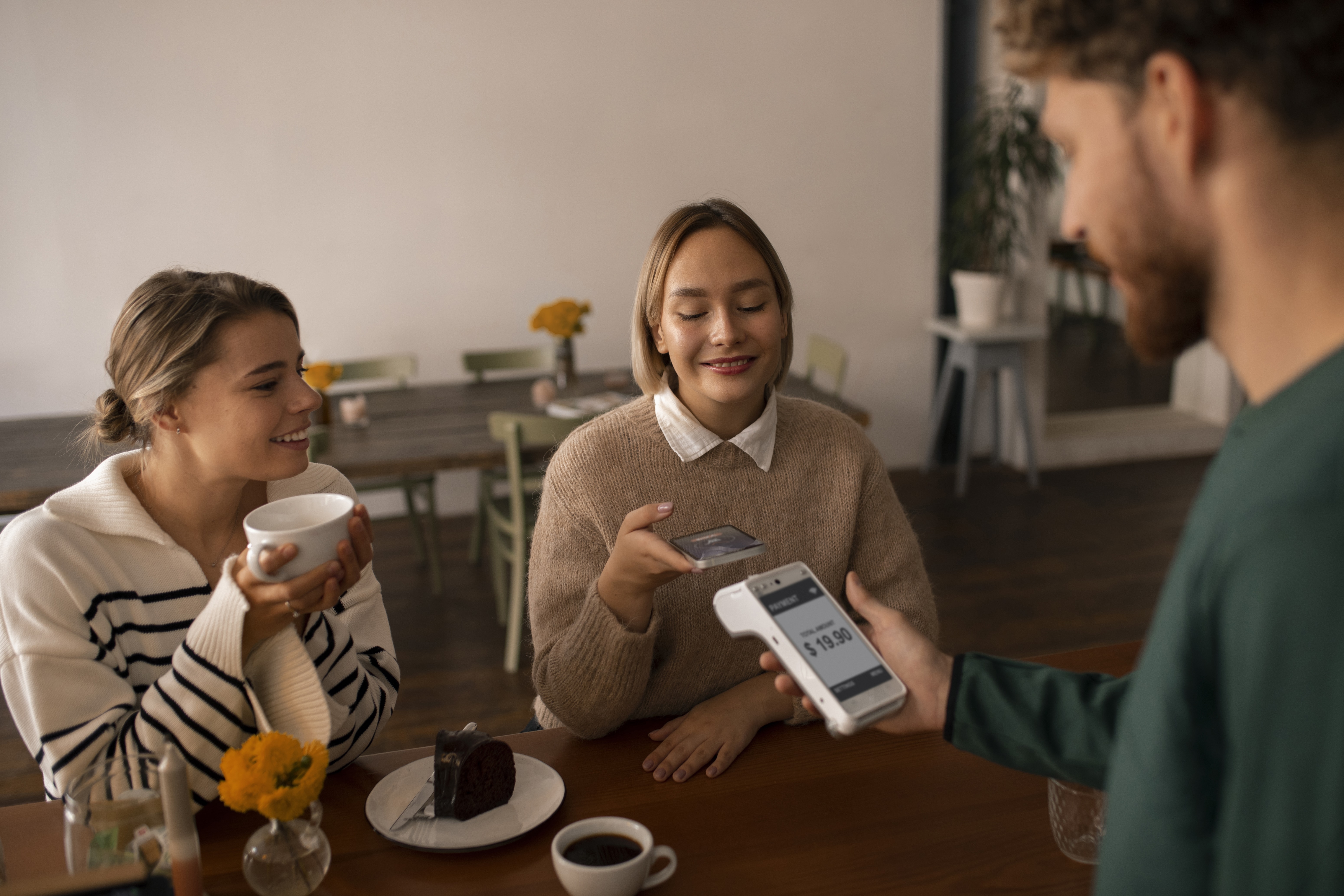 person-using-nfc-technology-pay-restaurant