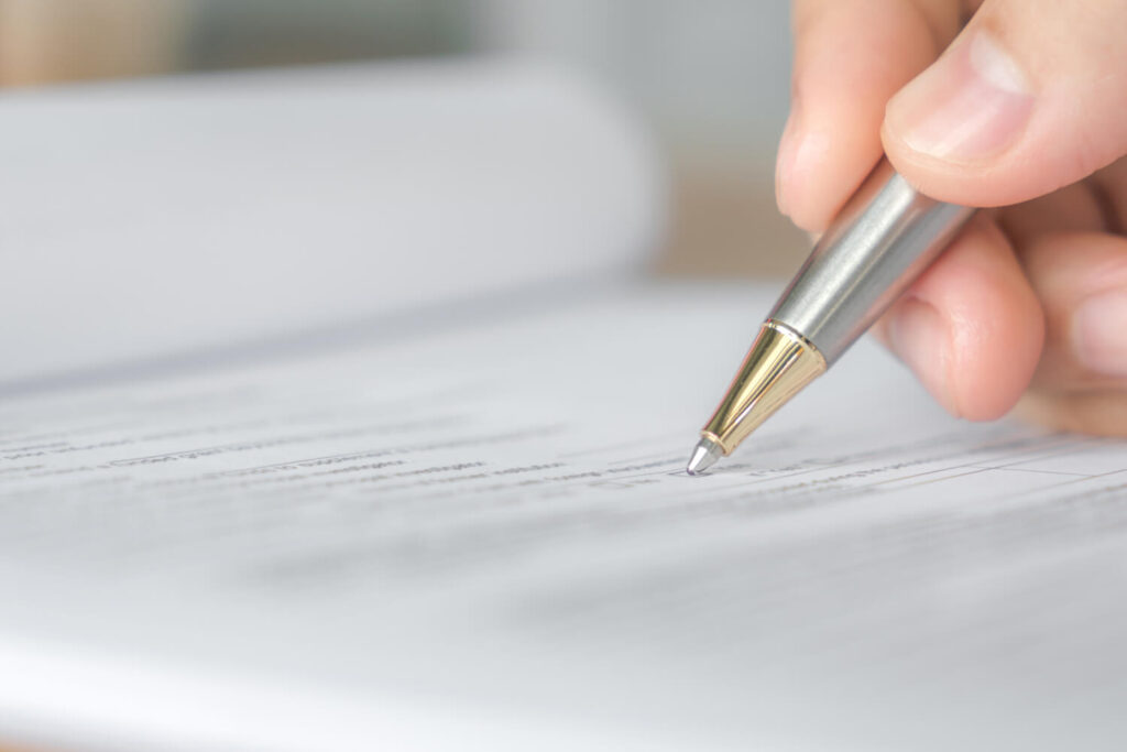 hand-with-pen-application-form