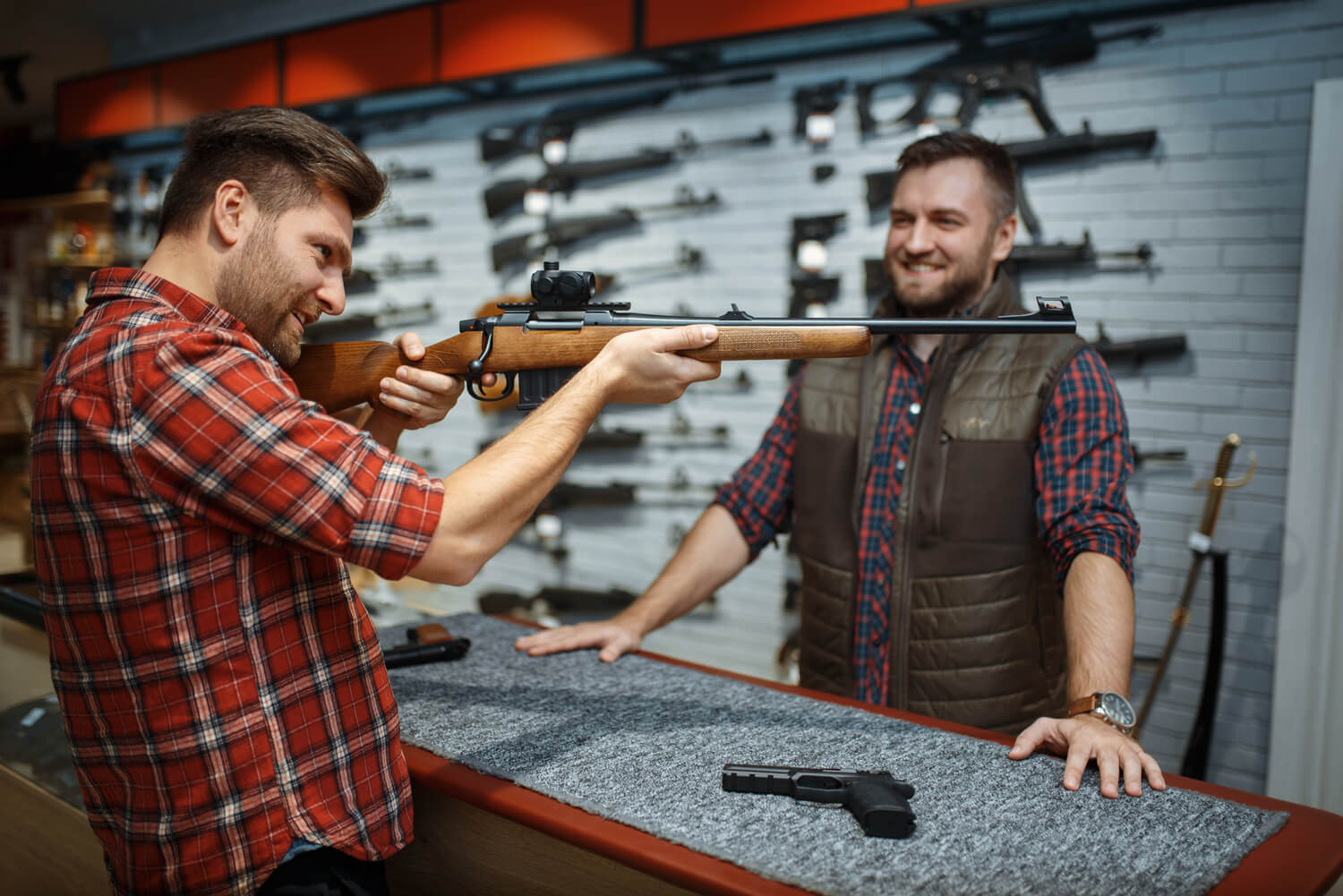 man-aims-with-new-rifle-seller-counter-gun-shop-male-person-buying-weapon-store-hunting-sport-shooting-hobby