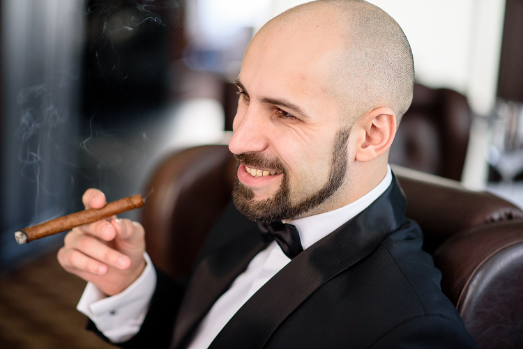 brutal-man-dress-coat-smokes-cigar 1