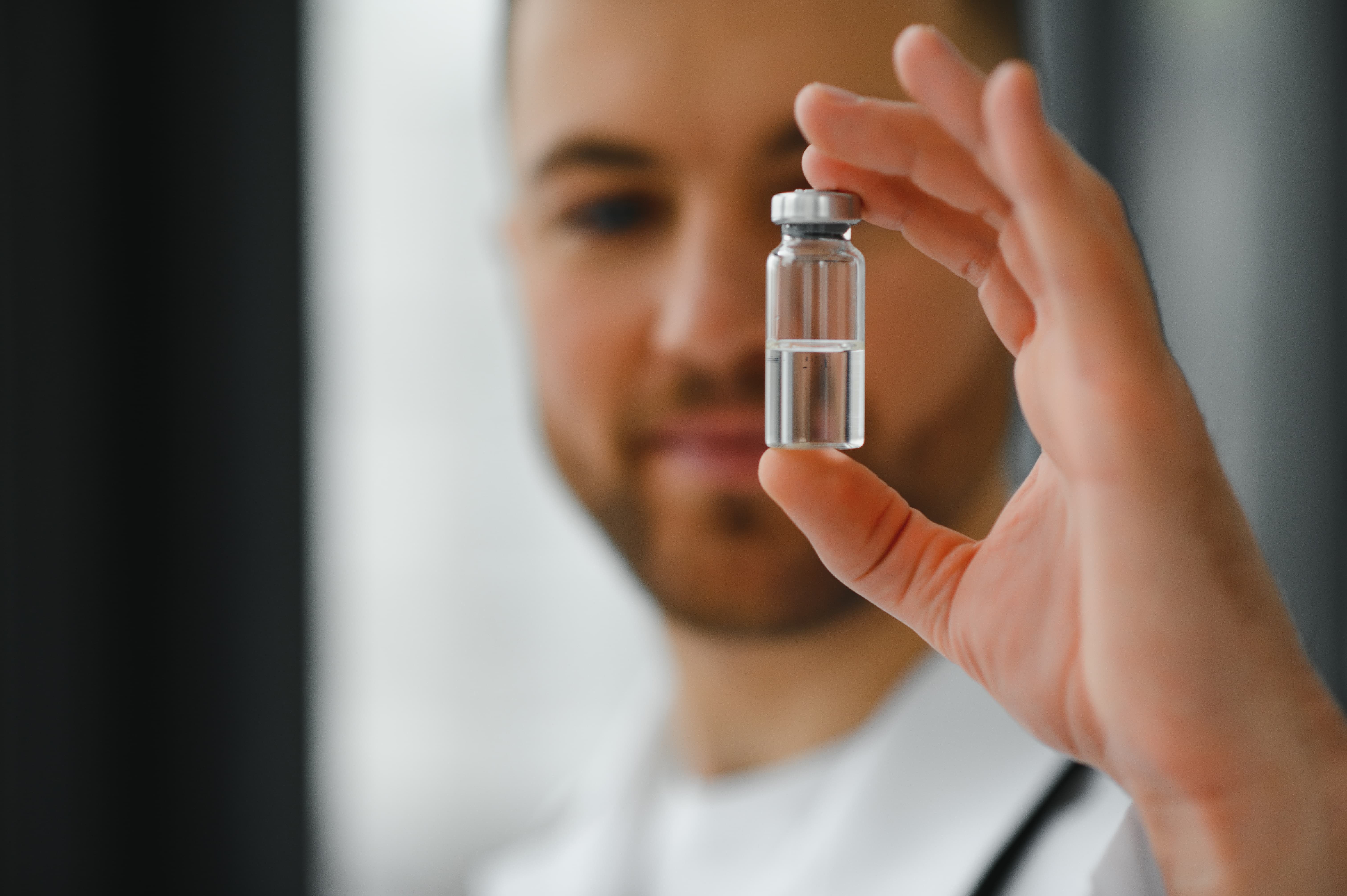 medical-doctor-holds-vaccine-patient