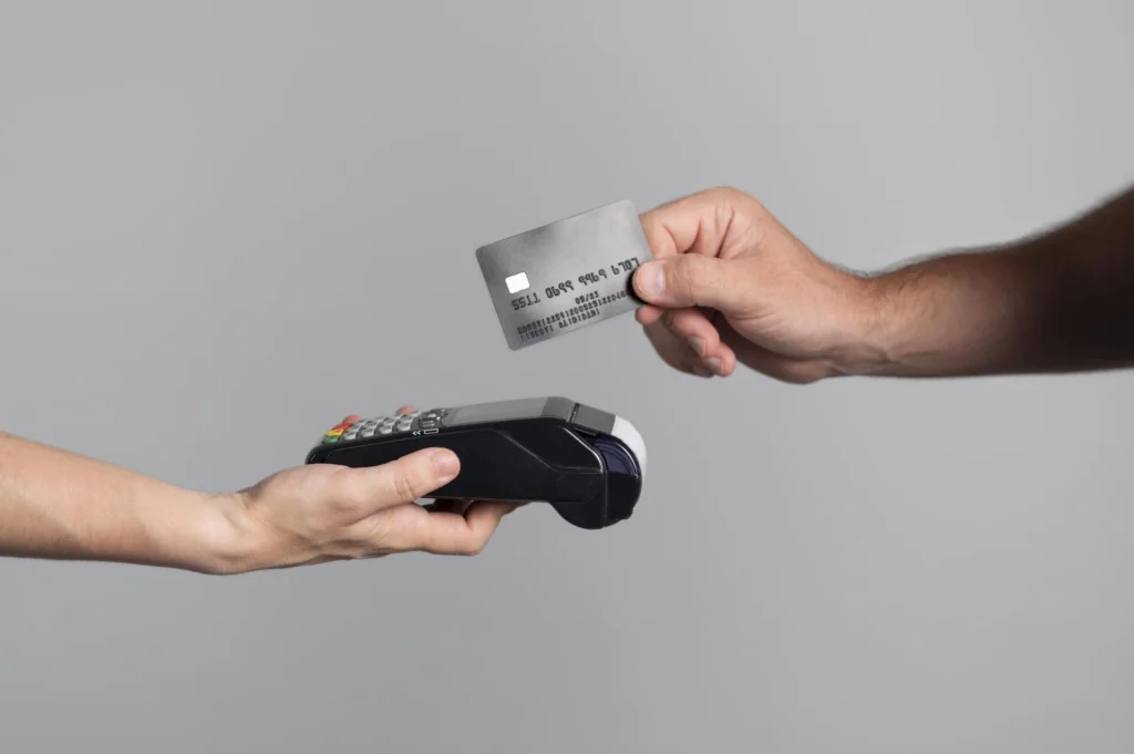 man-using-his-credit-card-pay-product