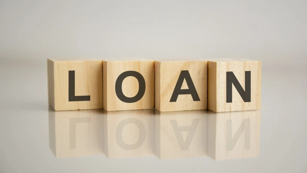 four-wooden-cubes-with-letters-loan-business-marketing-concept