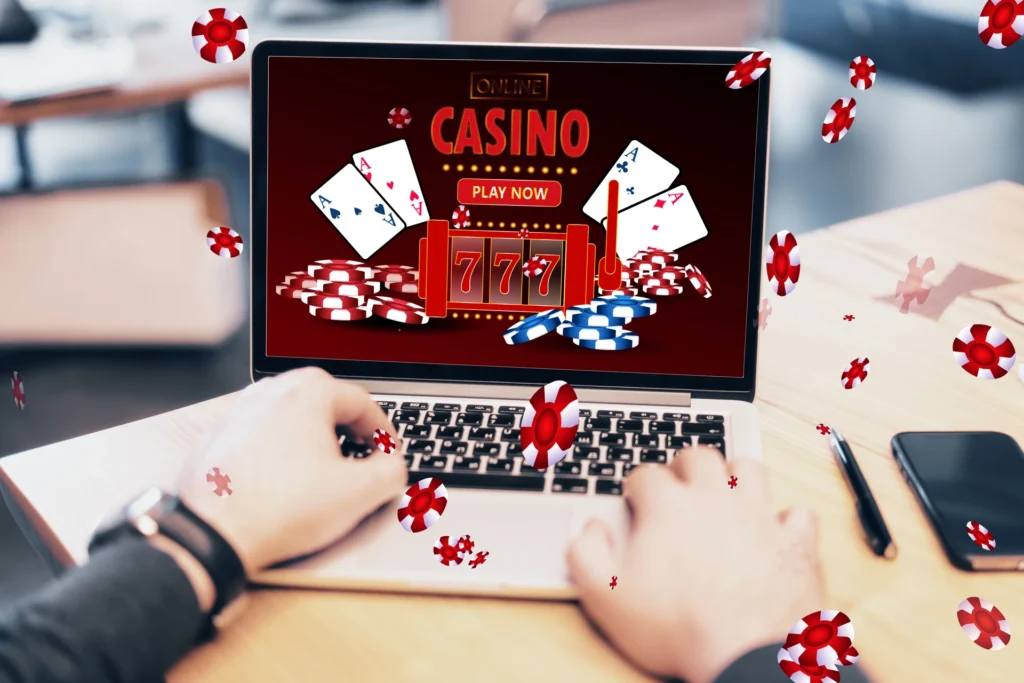 online-casino-gaming-gambling-device-concept-close-up-male-hands-using-laptop-computer-workplace-with-creative-slot-machine-other-games