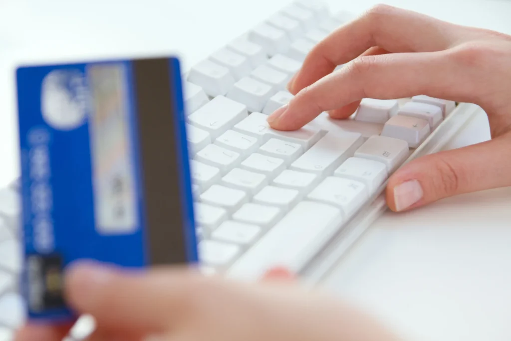 woman-hands-laptop-credit-card-shopping-online-payment
